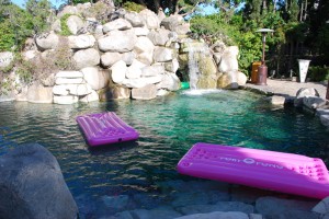 The Grotto At The Playboy Mansion pink infltable beer pong tables at the playboy mansion